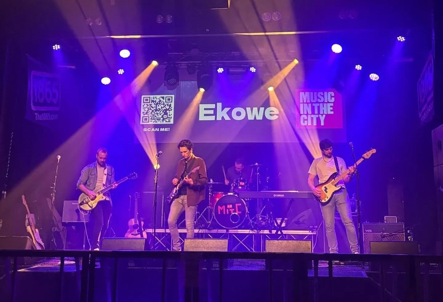 Ekowe playing live on stage